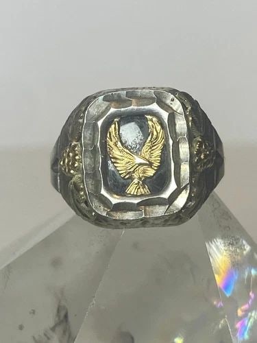 EAGLE RING ONYX BAND STERLING SILVER WOMEN GIRLS SIZE 5.75: EAGLE RING ONYX BAND STERLING SILVER WOMEN GIRLS SIZE 5.75 Eagle ring onyx band sterling silver women girls Detailed with overlay of some type of gold metal Size 5.75 Weight 5.6g Length 1/2" Width. 1/