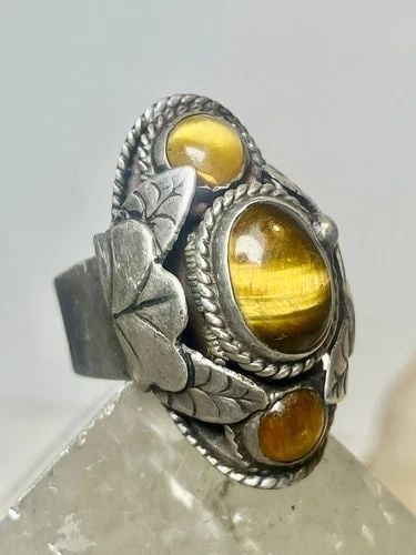 TIGER EYE RING SIZE 6 ADJ POISON MEXICAN STERLING SILVER WOMEN: TIGER EYE RING SIZE 6 ADJ POISON MEXICAN STERLING SILVER WOMEN Tiger Eye ring poison Mexican sterling silver women Size 6 adjustable Weight 7.7g Length. 1" Width. 1/2" Thinnest part of band. 3/16"