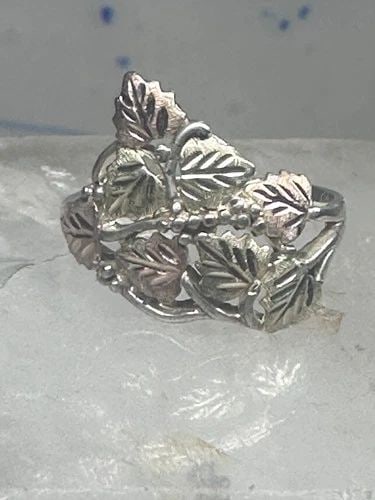 BLACK HILLS GOLD RING LEAVES BAND SIZE 8.7 STERLING SILVER WOMEN: Black Hills Gold ring leaves band size 8.7 sterling silver women Size 8.75 Between a size 8.75 and a size 9 Weight. 3.2g Width. 5/8" Thinnest part of band 1/8"