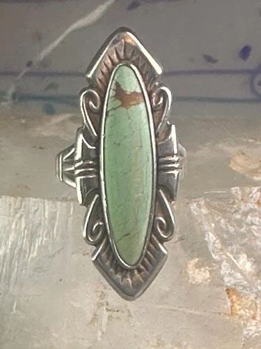 NAVAJO RING LONG TURQUOISE SIZE 7 STERLING SILVER WOMEN: NAVAJO RING LONG TURQUOISE SIZE 7 STERLING SILVER WOMEN Navajo ring long turquoise size 7 sterling silver women Size 7 Weight. 9.3g Length 1 5/8" Width. 5/8" Thinnest part of band 5/32"
