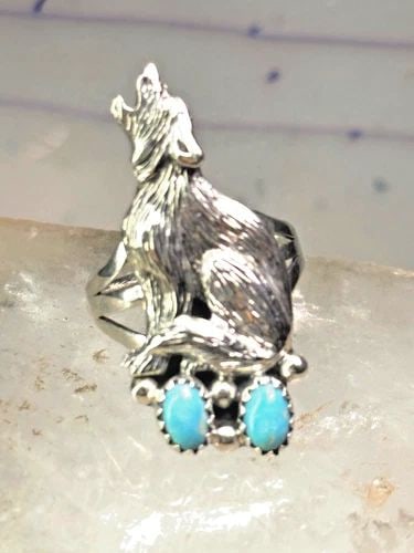 NAVAJO WOLF RING TURQUOISE BAND SIZE 8 STERLING SILVER MEN WOMEN: NAVAJO WOLF RING TURQUOISE BAND SIZE 8 STERLING SILVER MEN WOMEN Navajo wolf Ring turquoise band size 8 sterling silver men women Size 8 Weight 6.9g Length. 1 3/8" Width 5/8" Thinnest part of band 1/8