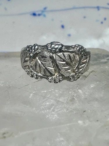 BLACK HILLS GOLD RING LEAVES WEDDING BAND SIZE 7.5 STERLING SILVER WOMEN MEN: Black Hills gold ring leaves wedding band size 7.5 sterling silver women men Size 7.5 Weight. 4.4g Width. 3/8" Thinnest part of band 1/4"