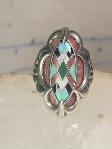 POLLACK RING PINK RHODONITE TURQUOISE SIZE 6 STERLING SILVER WOMEN: POLLACK RING PINK RHODONITE TURQUOISE SIZE 6 STERLING SILVER WOMEN Pollack Ring Pink Rhodonite Turquoise size 6 sterling silver women Size 6 Weight 12.9g Length 1 1/8" Width 1/2" Thinnest part of band