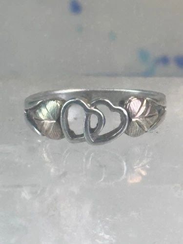 BLACK HILLS GOLD RING HEART LOVE BAND VALENTINE LEAVES SIZE 6.75 STERLING SILVER: BLACK HILLS GOLD RING HEART LOVE BAND VALENTINE LEAVES SIZE 6.75 STERLING SILVER Black Hills Gold ring heart love band Valentine leaves size 6.75 sterling silver women Size 6.75 Between a size 6.75 an