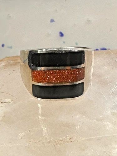 ONYX RING GOLDSTONE BAND SIZE 12 MEXICO BAND STERLING SILVER WOMEN MEN: ONYX RING GOLDSTONE BAND SIZE 12 MEXICO BAND STERLING SILVER WOMEN MEN Onyx ring goldstone band size 12 Mexico band sterling silver women men Size 12 Weight 16g Length. 1/2" Width 1/2" Thinnest part 3