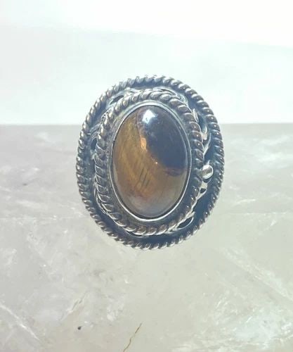 POISON RING SIZE 6 TIGER EYE MEXICO STERLING SILVER WOMEN GIRLS: POISON RING SIZE 6 TIGER EYE MEXICO STERLING SILVER WOMEN GIRLS Poison ring Tiger Eye Mexico sterling silver women girls Size 6 adjustable Weight 10.7g Length. 1" Width 3/4" Thinnest part 1/8"