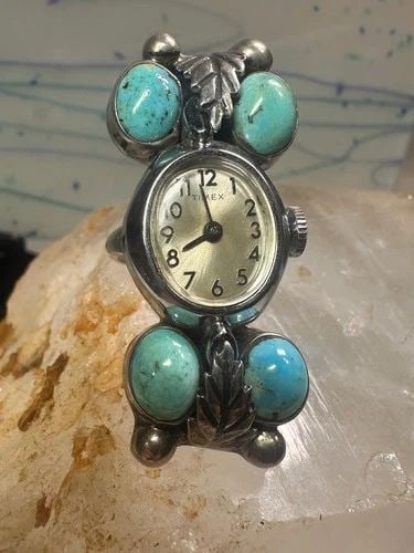 NAVAJO WATCH RING TURQUOISE SIZE 5 STERLING SILVER WOMEN: NAVAJO WATCH RING TURQUOISE SIZE 5 STERLING SILVER WOMEN Navajo Watch Ring Turquoise size 5 sterling silver women DOES NOT WORK Size 5 Weight 19.3g Length 1. 3/4" Width 3/4" Thinnest part of band 5/32