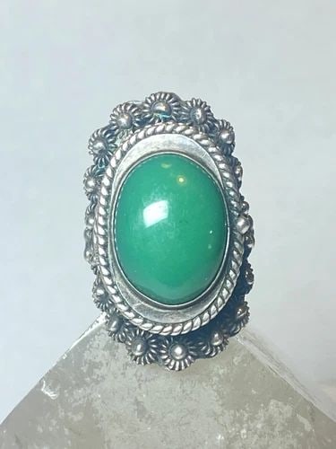 POISON RING GREEN MEXICAN STERLING SILVER WOMEN: POISON RING GREEN MEXICAN STERLING SILVER WOMEN Poison ring green Mexican sterling silver women size 9.25 adjustable Weight. 22.1g Length. 1 1/2" Width 3/4" Thinnest back of band 1/4"
