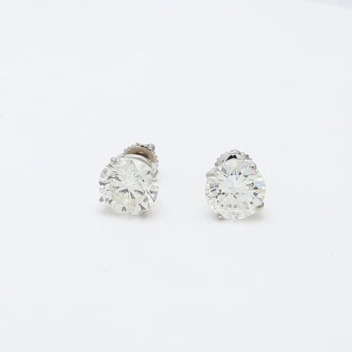 5.03 CARAT J–K I2 ROUND BRILLIANT DIAMOND 14K WHITE GOLD STUD EARRINGS: 5.03 CARAT J–K I2 ROUND BRILLIANT DIAMOND 14K WHITE GOLD STUD EARRINGS Title: These impressive 5.03 carat diamond stud earrings offer a bold, classic look with exceptional sparkle. Each earring feat