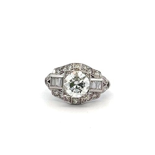 1.83 CARAT CIRCULAR BRILLIANT AND BAGUETTE SHAPE DIAMOND PLATINUM ART-DECO RING: PRODUCT DESCRIPTION Title: 1.83 Carat Circular Brilliant Cut K VVS2 and Old European Cut I SI1 and Baguette Shape I SI1 Diamond Platinum Art Deco Ring Style: Art Deco Metal: Platinum Gemstone 1: 1.53 