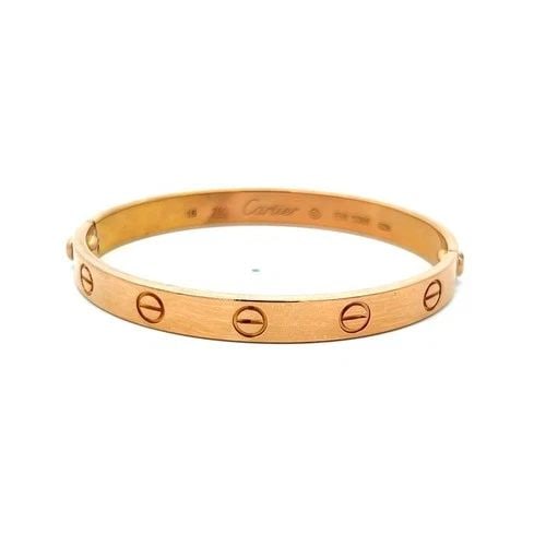 CARTIER 18 KARAT ROSE GOLD LOVE BRACELET SIZE 16: CARTIER 18 KARAT ROSE GOLD LOVE BRACELET SIZE 16 PRODUCT DESCRIPTION Designer: CARTIER Title: Cartier 18 Karat Rose Gold Love Bracelet Style: Love Metal: 18 Karat Rose Gold Dimension: 16 Weight: 33.4 