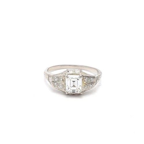 1.14 CARAT EMERALD CUT E SI1 & ROUND BRILLIANT I I1 DIAMOND PLATINUM RING: 1.14 CARAT EMERALD CUT E SI1 & ROUND BRILLIANT I I1 DIAMOND PLATINUM RING Title: 1.14 Carat Emerald Cut E SI1 and Round Brilliant I I1 Diamond Platinum Engagement Ring Style: Engagement Metal: Platinu