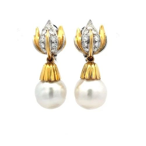 VINTAGE 18K GOLD DROP EARRINGS WITH 1 CARAT ROUND DIAMONDS & SOUTH SEA PEARLS: VINTAGE 18K GOLD DROP EARRINGS WITH 1 CARAT ROUND DIAMONDS & SOUTH SEA PEARLS Detailed Description: Embrace timeless elegance with these vintage earrings, crafted in 18 karat yellow gold. Each earring