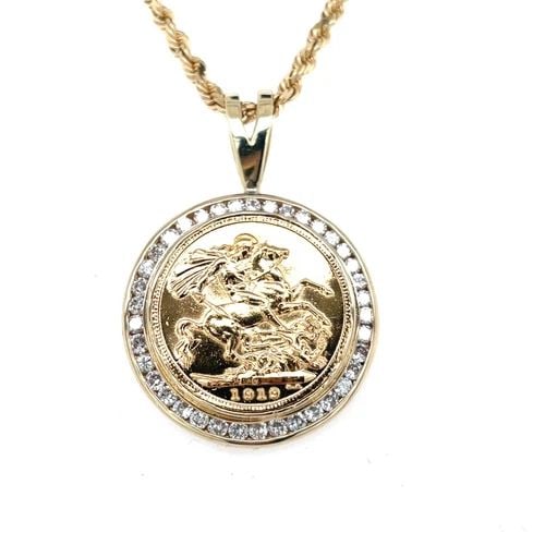 GREAT BRITAIN GOLD SOVEREIGN, KING GEORGE V COIN NECKLACE WITH DIAMOND BEZEL: GREAT BRITAIN GOLD SOVEREIGN, KING GEORGE V COIN NECKLACE WITH DIAMOND BEZEL British Sovereign Coin Necklace Set in a 14K yellow gold bezel - Pendant Length: 1.7" Pendant Width: 1.2" Pendant Weight: 1