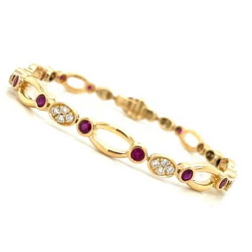RUBY & DIAMOND BRACELET IN 18K YELLOW GOLD WITH APPROXIMATELY 2.08CTS OF RUBY: RUBY & DIAMOND BRACELET IN 18K YELLOW GOLD WITH APPROXIMATELY 2.08CTS OF RUBY This stunning bracelet features approximately 2 08 carats of natural red rubies and 32 round brilliant diamonds set in 18k