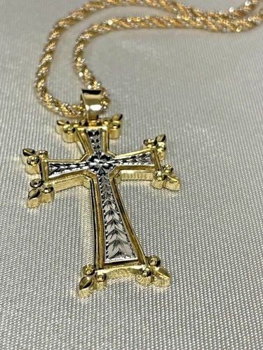 18K SOLID GOLD ENGRAVED HAWAIIAN MAILE LEAF AND FLOWER CROSS PENDANT: 18K SOLID GOLD ENGRAVED HAWAIIAN MAILE LEAF AND FLOWER CROSS PENDANT Beautiful Hand Carved Cross Pendant Featuring the elegant Hawaiian Maile Leaf and Flower Solid 18K Two-tone Gold The pendant measur