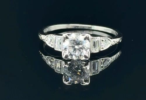 .60CT NATURAL DIAMOND H-VS2 ENGAGEMENT RING .14CT DIAMOND ACCENTS VVS-VS: .60CT NATURAL DIAMOND H-VS2 ENGAGEMENT RING .14CT DIAMOND ACCENTS VVS-VS Beautiful Diamond Engagement Ring in 14k White Gold Featuring a Emerald Cut Diamond .60ct Center, H, VS2 Weight - 2.4g Size 5.2