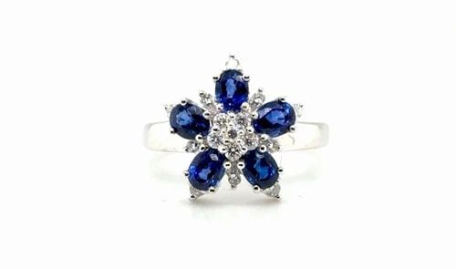 1.7 CARAT NATURAL BLUE SAPPHIRE AND DIAMOND RING IN 18K WHITE GOLD: 1.7 CARAT NATURAL BLUE SAPPHIRE AND DIAMOND RING IN 18K WHITE GOLD Elevate your look with this stunning cocktail ring crafted in 14K white gold weighing 4 4g Featuring a captivating oval-cut pink tour