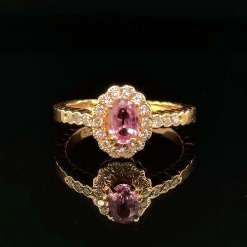 .64CT PINK SAPPHIRE AND DIAMOND RING IN 14K YELLOW GOLD: .64CT PINK SAPPHIRE AND DIAMOND RING IN 14K YELLOW GOLD Elevate your look with this stunning Unisex ring crafted in 14K yellow gold Featuring a captivating pear cut natural pink sapphire weighing 64ct