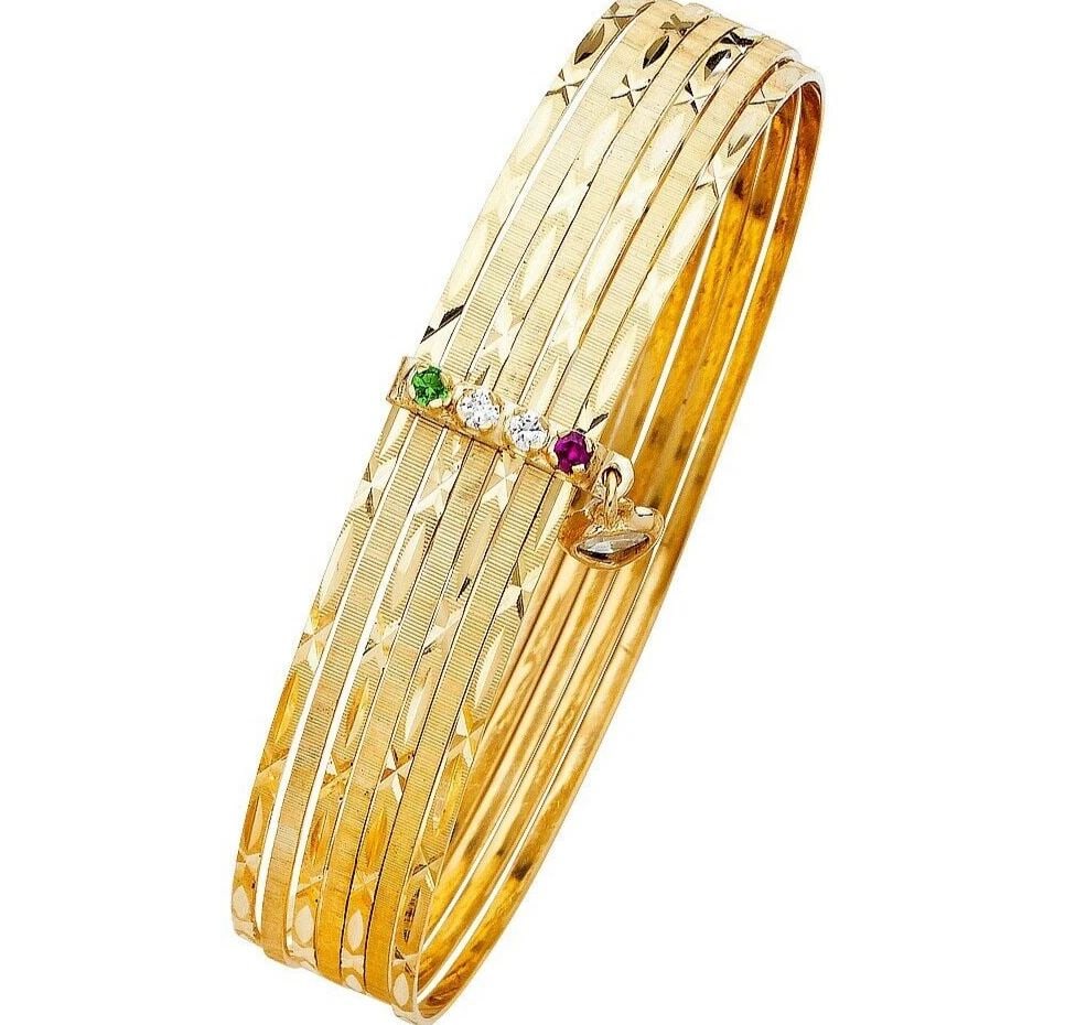 NEW 14K YELLOW GOLD 7DAYS SOLID BANGLE: NEW 14K YELLOW GOLD 7DAYS SOLID BANGLE 7DAYS SOLID BANGLE NEW 14K YELLOW GOLD C Z LENGTH - 7in Apx WEIGHT - 24.2g .
