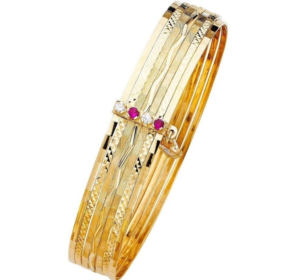 NEW 14K YELLOW GOLD 7 DAYS SOLID BANGLE: NEW 14K YELLOW GOLD 7DAYS SOLID BANGLE WITH C Z 7DAYS SOLID BANGLE WITH CZ NEW 14K YELLOW GOLD LENGTH - 7in Apx WEIGHT - 24.1g