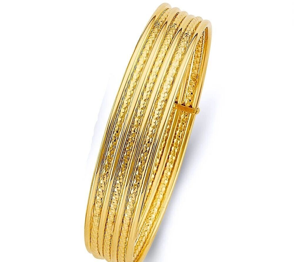 NEW 14K YELLOW GOLD 7DAYS HOLLOW BANGLE: NEW 14K YELLOW GOLD 7DAYS HOLLOW BANGLE 7DAYS HOLLOW BANGLE NEW 14K YELLOW GOLD LENGTH - 7in Apx WEIGHT - 11.1g .