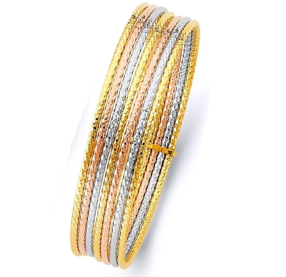 NEW 14K TRI COLOR GOLD 7DAYS HOLLOW BANGLE: NEW 14K TRI COLOR GOLD 7DAYS HOLLOW BANGLE 7DAYS HOLLOW BANGLE NEW 14K TRI COLOR GOLD LENGTH - 7in Apx WEIGHT - 10.8g .