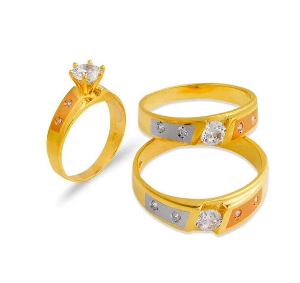 NEW 14K TRI COLOR GOLD WEDDING TRIO RING SET: NEW 14K TRI COLOR GOLD WEDDING TRIO RING SET 14K Tricolor Gold Ladies band and engagement ring is size 7 Men's ring is size 10 Rings Also Sold Separately Available in Yellow Gold Weight: 8.9 Grams
