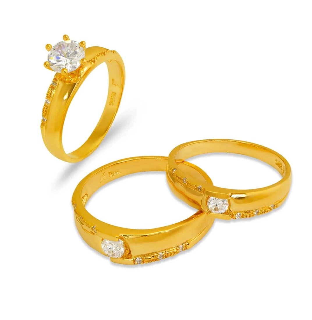 NEW 14K YELLOW GOLD WEDDING TRIO RING SET: NEW 14K YELLOW GOLD WEDDING TRIO RING SET 14K Yellow Gold Ladies band and engagement ring is size 7 Men's ring is size 10 Rings Also Sold Separately Available in Tricolor and White Gold Weight: 8.8 Gr