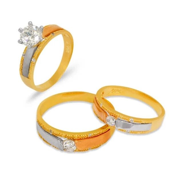 NEW 14K TRI COLOR GOLD WEDDING TRIO RING SET: NEW 14K TRI COLOR GOLD WEDDING TRIO RING SET 14K Tricolor Gold Ladies band and engagement ring is size 7 Men's ring is size 10 Rings Also Sold Separately Available in Yellow and White Gold Weight: 8.7
