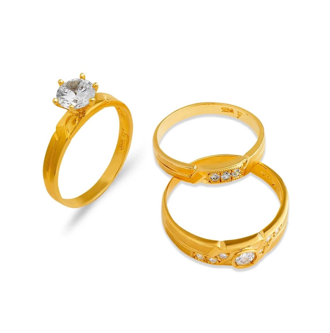 NEW 14K YELLOW GOLD WEDDING TRIO RING SET: NEW 14K YELLOW GOLD WEDDING TRIO RING SET 14K Yellow Gold Ladies band and engagement ring is size 7 Men's ring is size 10 Rings Also Sold Separately Available in TWO TONE Gold Weight: 7.0 Grams