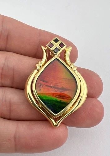 KORITE 18K YELLOW GOLD LARGE GRAND PRINCESS AA AMMOLITE RUBY SAPPHIRE PENDANT: KORITE 18K YELLOW GOLD LARGE GRAND PRINCESS AA AMMOLITE RUBY SAPPHIRE PENDANT Designer Korite 18K Yellow Gold Large Grand Princess AA Ammolite Ruby Sapphire Pendant Featured is an authentic Korite des