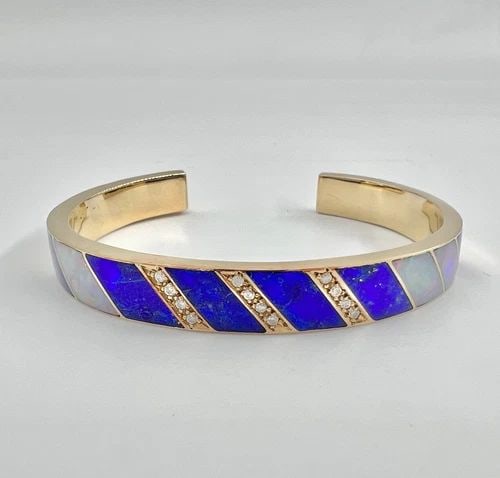 NAVAJO 18K YELLOW GOLD NATURAL LAPIS LAZULI & FIRE OPAL & DIAMOND CUFF BRACELET: NAVAJO 18K YELLOW GOLD NATURAL LAPIS LAZULI & FIRE OPAL & DIAMOND CUFF BRACELET Vintage Navajo 18K Yellow Gold Natural Lapis Lazuli & Fire Opal & Diamond Cuff Bracelet Cuff is 5 1/4" Tip to Tip and ha
