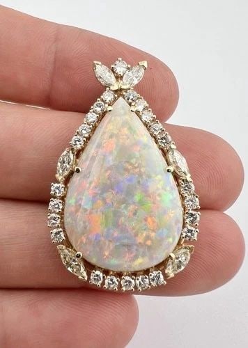 14K YELLOW GOLD 35CT AUSTRALIAN OPAL & ROUND & MARQUISE DIAMOND TEARDROP PENDANT: 14K YELLOW GOLD 35CT AUSTRALIAN OPAL & ROUND & MARQUISE DIAMOND TEARDROP PENDANT Fine 14k Yellow Gold 35.00ct Australian Fire Opal & Round & Marquise Diamond Teardrop Pendant Size: 1 1/2" Tall by 1" W