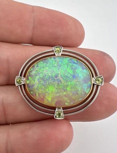ANTIQUE ART DECO PLATINUM & 18K YELLOW GOLD AUSTRALIAN FIRE OPAL PIN BROOCH: ANTIQUE ART DECO PLATINUM & 18K YELLOW GOLD AUSTRALIAN FIRE OPAL PIN BROOCH Antique Art Deco Platinum & 18k Yellow Gold Australian Fire Opal Pin Brooch Size: Over 1 1/4" Wide by 1 1/8" Tall Weight is 
