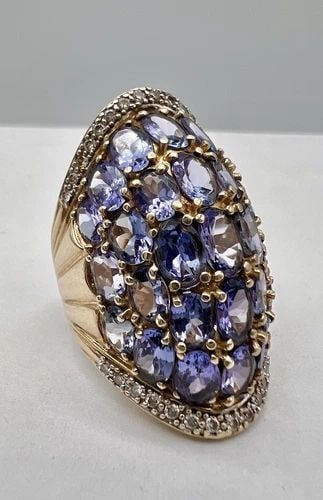 DESIGNER 14K YELLOW GOLD 15.00TCW APPROX. TANZANITE & DIAMOND WIDE BAND RING 15G: Designer 14k Yellow Gold 15.00tcw Approx. Tanzanite & Diamond Wide Band Ring 15g Ring Size: 7.75 - Can Be Resized Metal: 14k Yellow Gold Weight is 15.0 Grams on my scale Amazing 15.00tcw Approx. Tanza