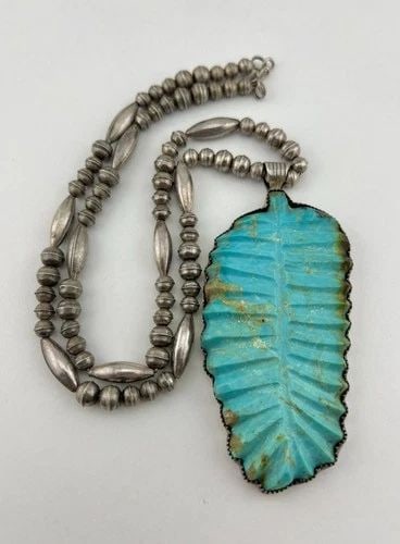 VTG LEEKYA DEYUSE? STERLING SILVER CARVED TURQUOISE LEAF FETISH PENDANT NECKLACE: Vtg Leekya Deyuse? Sterling Silver Carved Turquoise Leaf Fetish Pendant Necklace MEASUREMENTS: Necklace measures 24.25" Tip To Tip Pendant is Over 4" Tall With Bail by Over 1 3/4" Wide Bench Bead Pear