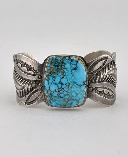 1920'S CHISELED INGOT COIN SILVER NAVAJO LONE MOUNTAIN TURQUOISE CUFF BRACELET: RARE 1920's OLD Chiseled Ingot Coin Silver Navajo Spiderweb Lone Mountain Turquoise Cuff Bracelet Cuff is 5 3/8" tip to Tip and has a 1 1/8" Wide - Slightly Adjustable Gap Cuff Is Around 1" At Its Wid