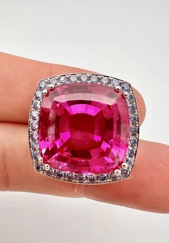 18K WHITE GOLD 30CT CUSHION LAB CREATED PINK SAPPHIRE & TANZANITE HALO PENDANT: 18K WHITE GOLD 30CT CUSHION LAB CREATED PINK SAPPHIRE & TANZANITE HALO PENDANT Designer 18K White Gold 30ct Cushion Lab Created Pink Sapphire & Tanzanite Halo Pendant Size: 7/8" (22mm) Tall & 7/8" (22