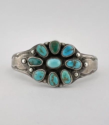 1940S NAVAJO COIN SILVER INGOT NATURAL CERRILLOS TURQUOISE STAMPED CUFF BRACELET: Early 1940s Navajo Coin Silver INGOT Natural Cerrillos Turquoise Stamped Cuff Bracelet Cuff is Around 5 1/2" tip to Tip and has an 1 1/4" Wide Slightly Adjustable Gap Cuff Is 1 1/8" Wide In the Center