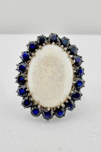 DESIGNER 18K WHITE GOLD NATURAL AUSTRALIAN FIRE OPAL & BLUE SAPPHIRE HALO RING: DESIGNER 18K WHITE GOLD NATURAL AUSTRALIAN FIRE OPAL & BLUE SAPPHIRE HALO RING Designer 18k White Gold Natural Australian Fire Opal & Blue Sapphire Halo Ring Ring Size: 8.25 - Can Be Resized Metal: 18