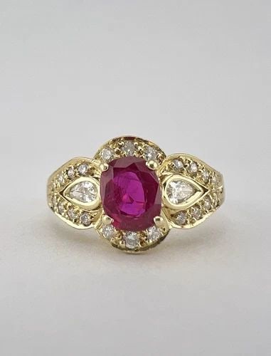 FINE .85CT OVAL BURMA THAI RUBY & HIGH QUALITY ROUND & PEAR SHAPED DIAMOND RING: FINE .85CT OVAL BURMA THAI RUBY & HIGH QUALITY ROUND & PEAR SHAPED DIAMOND RING Fine .85ct Oval Burma Thai Ruby & High Quality Round & Pear Shaped Diamond Ring Ring Size: 8 - Can Be Resized Metal: 18k