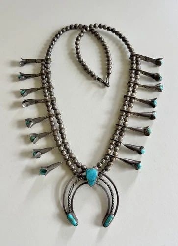 VINTAGE NAVAJO STERLING SILVER BLUE GEM TURQUOISE SQUASH BLOSSOM NECKLACE 25.5": Vintage Navajo Sterling Silver Blue Gem Turquoise Squash Blossom Necklace 25.5" This Amazing necklace features huge specimens of Natural Blue Gem Turquoise, secure in a Smooth bezel in A Blossom Desig