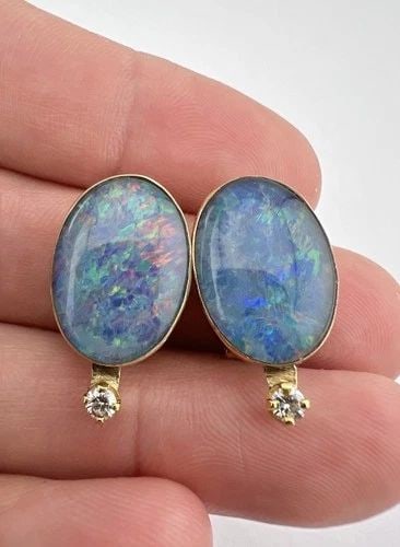 VINTAGE 14K YELLOW GOLD OVAL FIRE OPAL DOUBLETS & DIAMOND OMEGA BACK EARRINGS: VINTAGE 14K YELLOW GOLD OVAL FIRE OPAL DOUBLETS & DIAMOND OMEGA BACK EARRINGS Vintage 14k Yellow Gold Oval Fire Opal Doublets & Diamond Omega Back Earrings Size: 7/8" Tall by 3/8" Wide Weight is 7.5 G