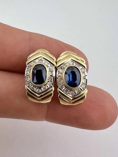 DESIGNER 14K YELLOW GOLD BLUE SAPPHIRE & DIAMOND HALO OMEGA BACK POST EARRINGS: DESIGNER 14K YELLOW GOLD BLUE SAPPHIRE & DIAMOND HALO OMEGA BACK POST EARRINGS Designer 14K Yellow Gold Blue Sapphire & Diamond Halo Omega Back Post Earrings Size: 3/4" Tall By Just Under 1/2" Wide Me