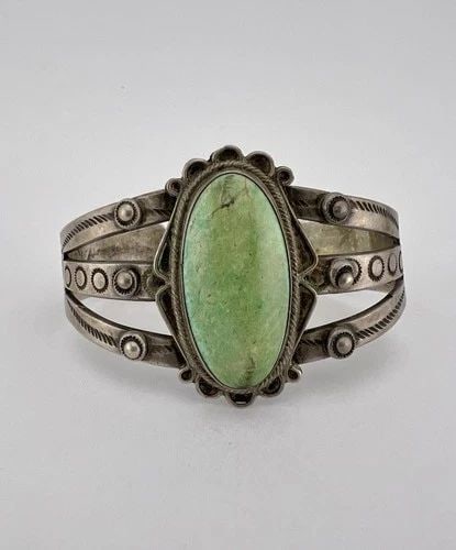 OLD 1940'S NAVAJO INGOT COIN SILVER CERRILLOS TURQUOISE STAMPED CUFF BRACELET: OLD 1940'S NAVAJO INGOT COIN SILVER CERRILLOS TURQUOISE STAMPED CUFF BRACELET OLD 1940's Navajo INGOT Coin Silver Cerrillos Turquoise Stamped Cuff Bracelet Cuff is 5 3/4" tip to Tip and has a 1" Wide 