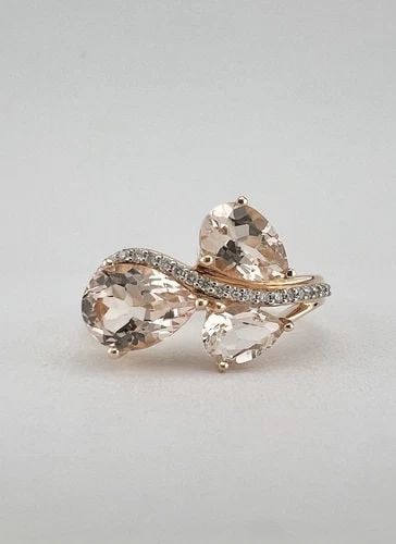 DESIGNER 14K ROSE GOLD PEAR SHAPED LIGHT PINK MORGANITE & DIAMOND BYPASS RING: DESIGNER 14K ROSE GOLD PEAR SHAPED LIGHT PINK MORGANITE & DIAMOND BYPASS RING Designer 14k Rose Gold Pear Shaped Light Pink Morganite & Diamond Bypass Ring Ring Size: 7.25 - Can Be Resized Metal: 14k 