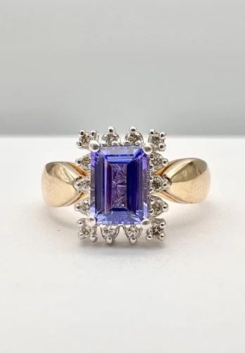 DESIGNER 14K YELLOW GOLD EMERALD CUT 1.10CT TANZANITE & DIAMOND HALO RING: DESIGNER 14K YELLOW GOLD EMERALD CUT 1.10CT TANZANITE & DIAMOND HALO RING Designer 14k Yellow Gold Emerald Cut 1.10ct Tanzanite & Diamond Halo Ring Size: 7.75 - Can Be Resized Weight is 5.3 Grams on m