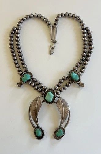 VINTAGE NAVAJO STERLING SILVER BLUE TURQUOISE SQUASH BLOSSOM NECKLACE 22.25": Vintage Navajo Sterling Silver Blue Turquoise Squash Blossom Necklace 22.25"This Amazing necklace features huge specimens of Natural Turquoise, secure in a Smooth bezel. Necklace has Around 9mm Wide b