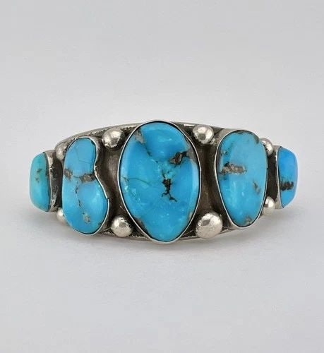 MELVIN THOMPSON NAVAJO STERLING SILVER KINGMAN TURQUOISE CUFF 5 STONE BRACELET: MELVIN THOMPSON NAVAJO STERLING SILVER KINGMAN TURQUOISE CUFF 5 STONE BRACELET Vintage Melvin Thompson Navajo Sterling Silver Kingman Turquoise Cuff 5 Stone Bracelet Cuff is 5 7/8" tip to Tip and has 